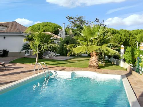 Nuevo Portil Villa | Elegant Villa in Nuevo Portil with Shared Pool