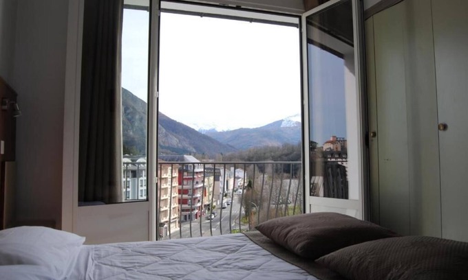 Lourdes Hotel | Enjoy Homelike Comfort & Balcony Sights w/Modern Amenities in Lourdes
