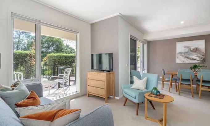 Port Melbourne Apartment | Exceptional Location on the park, the beach, gym, pool with a private garden.