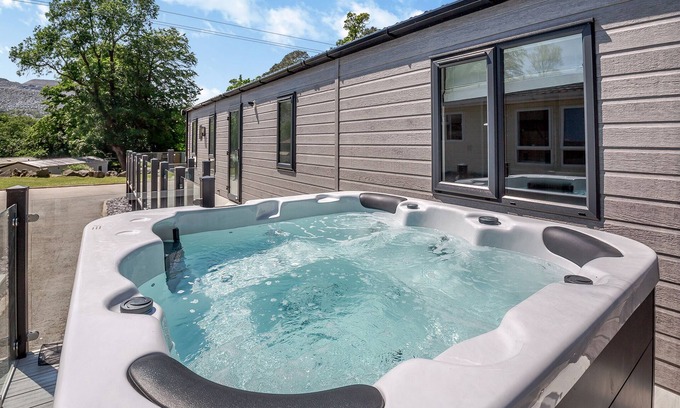 Bethesda Ski Chalet | Experience ultimate luxury with the brand-new Faraday lodge with hot tub.