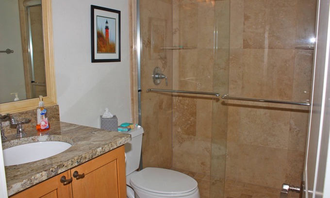 New Smyrna Beach Condo | Fantastic Oceanfront three bedroom. Travertine floors, custom kitchen and bathrooms. Luxury Condo!
