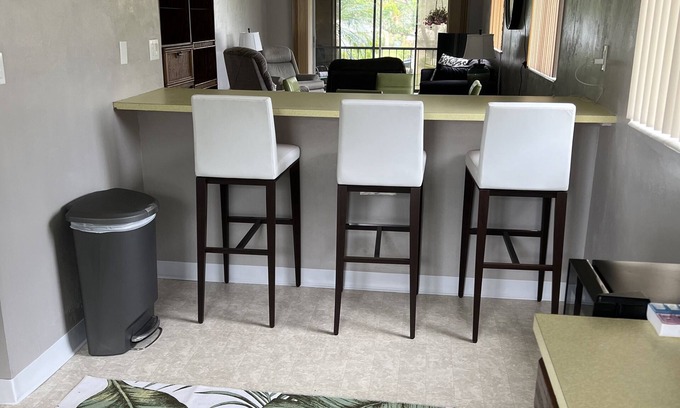 Villas Condo | Florida palm trees and warm sun! Central location- 8 miles to beaches