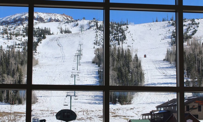 Brian Head Condo | FRONT AND CENTER for 8! PANORAMIC VIEWS! Wall of windows facing slopes! GARAGE!