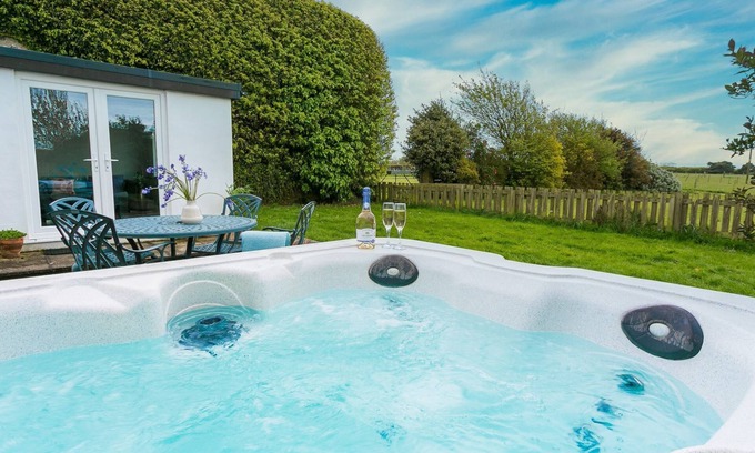Bryngwran Cottage | Gamekeeper's - a hot tub that sleeps 4 guests in 2 bedrooms