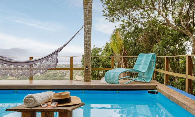 Praia do Rosa RV Rental | Glass House with Stunning View