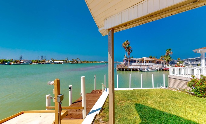 Port Isabel Cottage | Gorgeous Intercoastal waterfront home on channel w/shared pool, hot tub, & dock