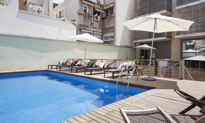 la Vila de Gracia Apartment | Gràcia: Cozy duplex with shared pool + terrace