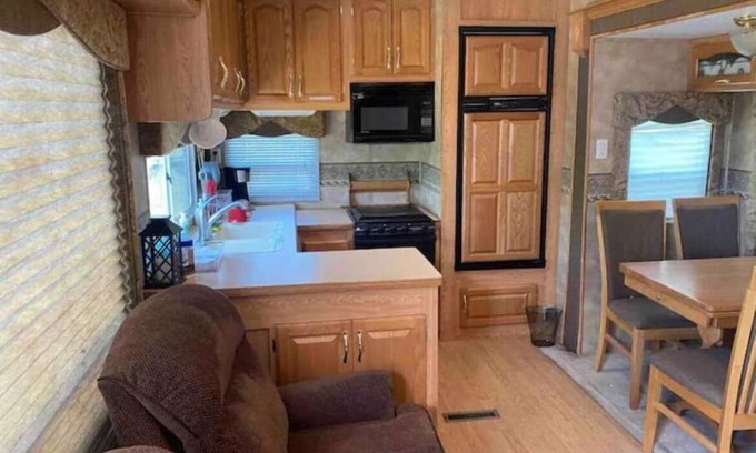 Swanlake House | Hammocks & kayaks with1 bed trailer, tiki torches, & tent space for extra guest