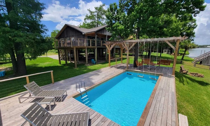 Barrett House | Houston Riverfront Getaway house with pool and hot tub