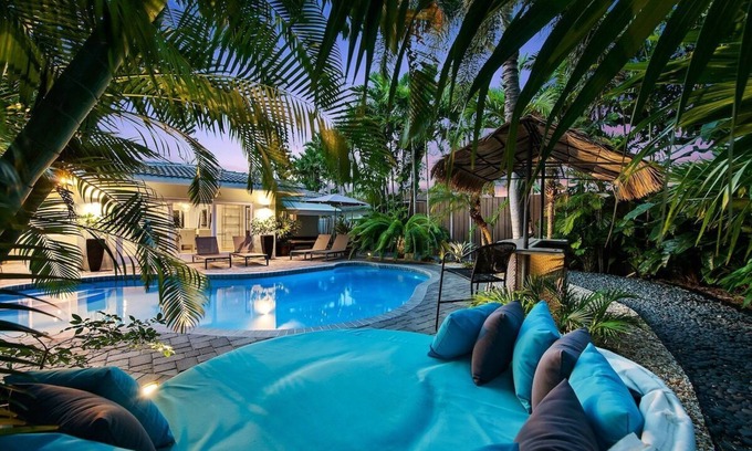 Central Fort Lauderdale House | Just 10min to downtown Ft. Lauderdale & beach, this modern home offers everything a group could want for an upscale relaxing getaway. Unwind in the very private and peaceful backyard oasis, featuring a heated ($) pool, 6-person hot tub & fire pit.