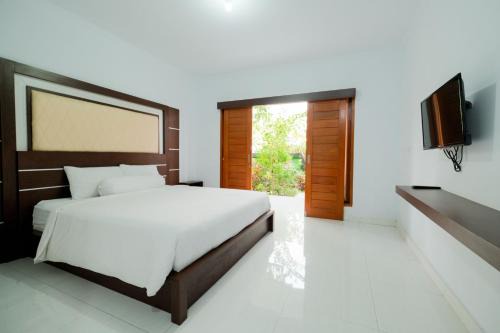 Padangsambian Klod House | Kadek Bagus Guesthouse Denpasar Mitra RedDoorz