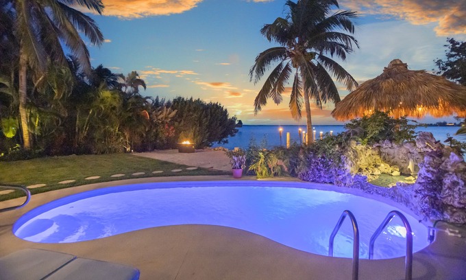 Bay Point House | Key West Beach House with heated pool, tiki, and dock.♿︎