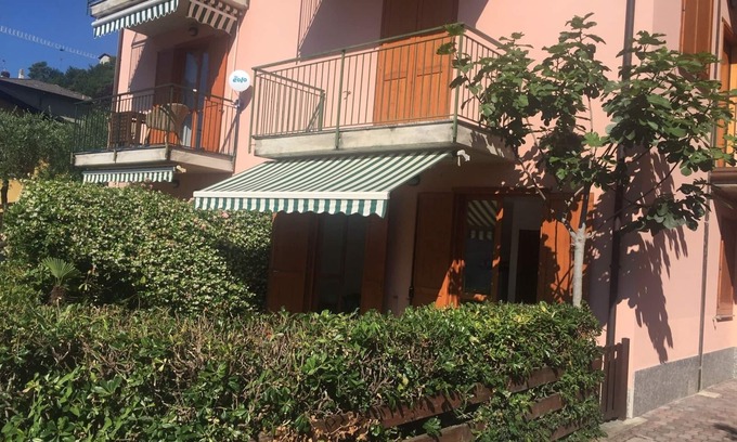 Sala Comacina Apartment | Lake View. Beautiful three-room apartment with garden and pool. Lake Como.