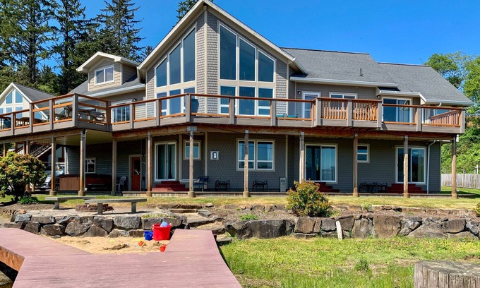 Lincoln City House | Lakefront, Family-Friendly Home w/a Private Hot Tub, Game Room, & Dock