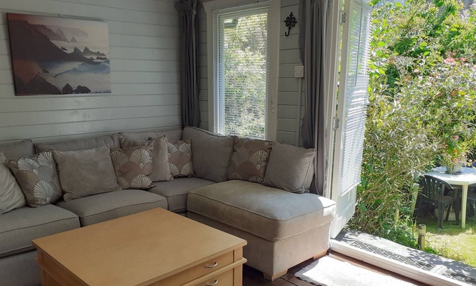 Hastings Cabin | Lovely Cabin set in a Beautiful Garden. Short Walk Into Town. Dogs Welcome