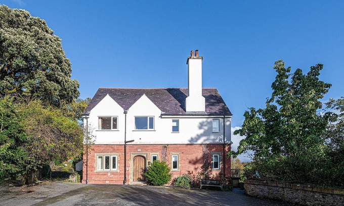 Menai Bridge House | Luxurious Arts and Crafts Home set in 5 Acres of Garden & Woodland onto Straits