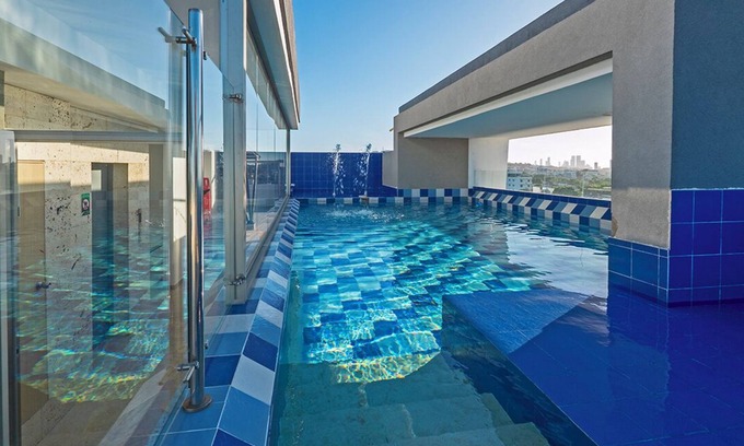 Urbanizacion Eliana Condo | Luxury Airport Penthouse - 3 BD 2 BA Suite + Rooftop Pool