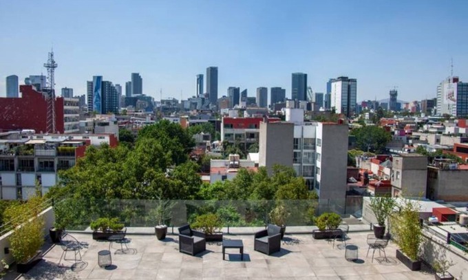Colonia Cuauhtemoc Apartment | Mid-Century's Morning Embrace: Revel in 'Nowness' Amidst Roma's Radiance.n