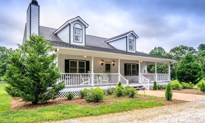 Hendersonville House | Modern and spacious home surrounded by scenic willow trees.