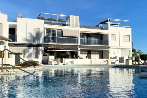 Orihuela Costa Apartment | Modern flat with swimming pool terrace and equipped solarium