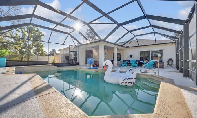 Palm Harbor House | Modern Poolside Getaway w Games, Fire pit & Family Fun