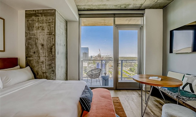 Rainey Street Historic District Apartment | Natiivo Austin studio - lake & skyline-view balcony, pool & gym - dogs OK