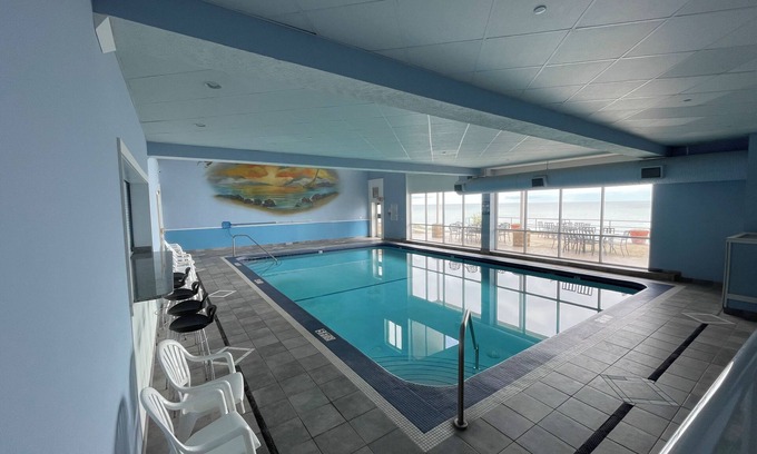 Geneva Condo | NEW 2-Bedroom Lakefront Condo with private beach/indoor pool-rent 3/4th free