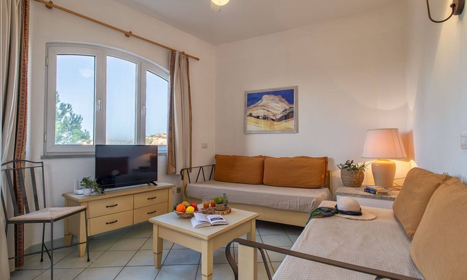 Canneddi Apartment | Nice apartment for 4 people with WIFI, pool, A/C, TV, terrace and pets allowed