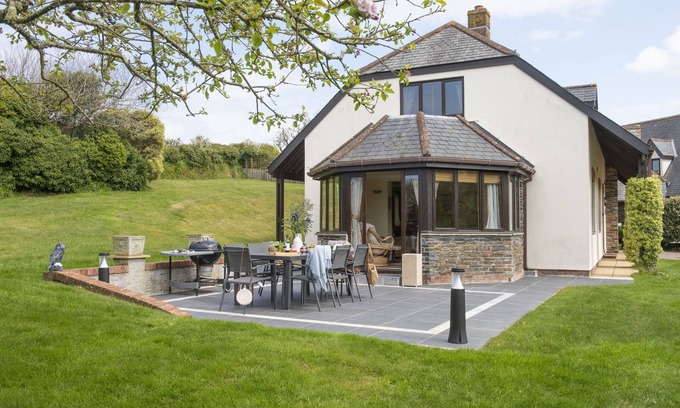 Wadebridge House | Overlooking the lakes of Roserrow, April Cottage is in an enviable location.