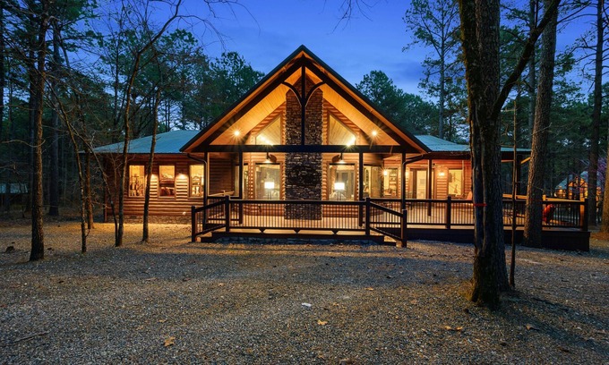 Broken Bow Cabin | Patio in the Pines offers all of the luxuries in an absolutely stunning vacation cabin. One of the outstanding features is a HUGE 1,200 square foot covered outdoor living space with soaring ceilings, adorned with a wine barrel chandelier.