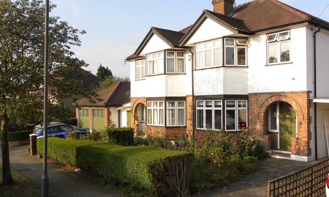 Harrow Weald House | Pets welcome at family home with piano and lovely garden with parking for two.