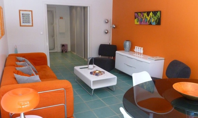 La Baule-Escoublac Apartment | Pop design apartment, renewed in 2008, terraces in the garden, heart of La Baule