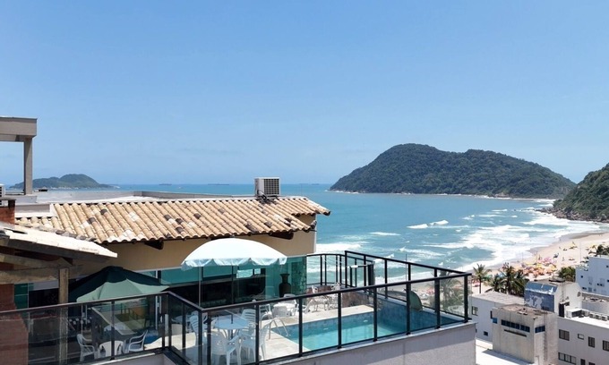 Guaiuba Apartment | Praia do Tombo Guarujá Coverage - Right on the sand, the best comfort for your family