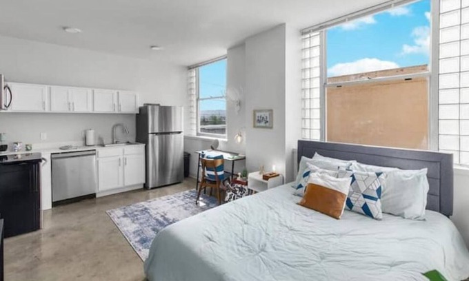 Central City Apartment | Private loft with rooftop deck, fitness center, and private parking.