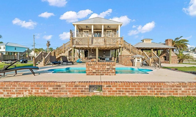 Shoreline Park House | Relaxing Waterfront Getaway with Pool, Boat Dock, and Ice House next door.