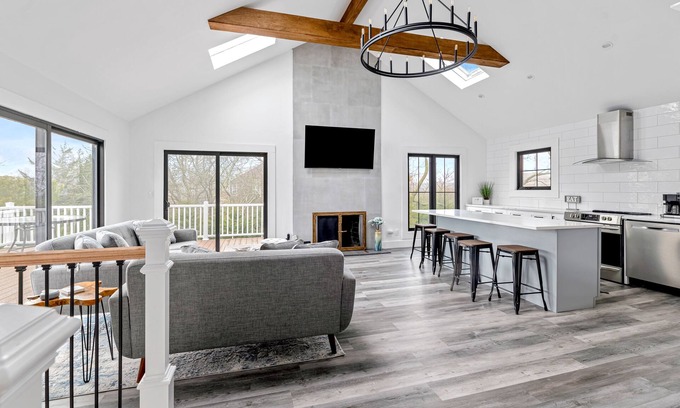 Hampton Bays House | Renovated retreat with a pool, grill, firepit, in-home gym, W/D, & AC