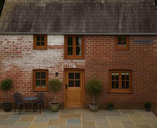 Llangadog House | Romantic Country Cottage with log burner, garden patio, outdoor tub and country views- Brecon Beacons National Park