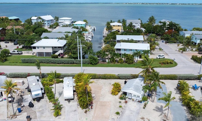 Cudjoe Key RV Rental | RV Lot in Oceanfront Community | Concrete Pad, Lush Landscaping, Walk to Pool & On Site Store