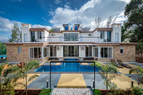 Karjat Villa | SaffronStays Casa De Familia, Karjat - pool villa with ample open space for outdoor games