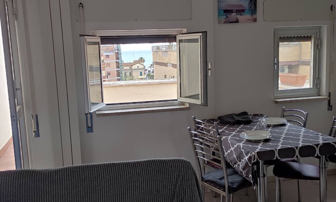 Quartiere XXXIV Lido di Ostia Levante Apartment | Sea view terrace 300 meters from the beach. and for the winter the fireplace.