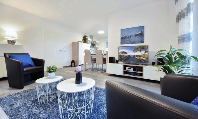 Korswandt Apartment | Sonnenpark 05 - modern furnishings and terrace with beach chair