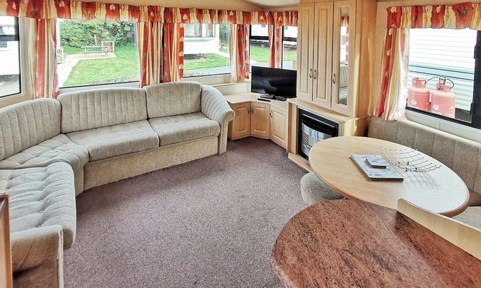 Aberystwyth House | Spacious 12ft-wide caravan with one double and one twin.