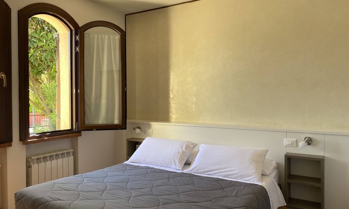 Colombare Apartment | Spacious JOLLY three-room apartment equipped with all comforts, with garden and terrace.