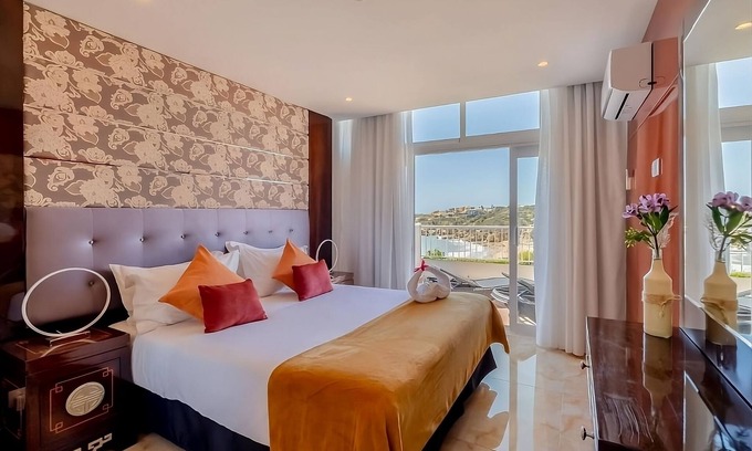Oura Hotel | Steps Away from Oura Beach! 3 Family Suites, 2 Outdoor Pools, Free Parking!