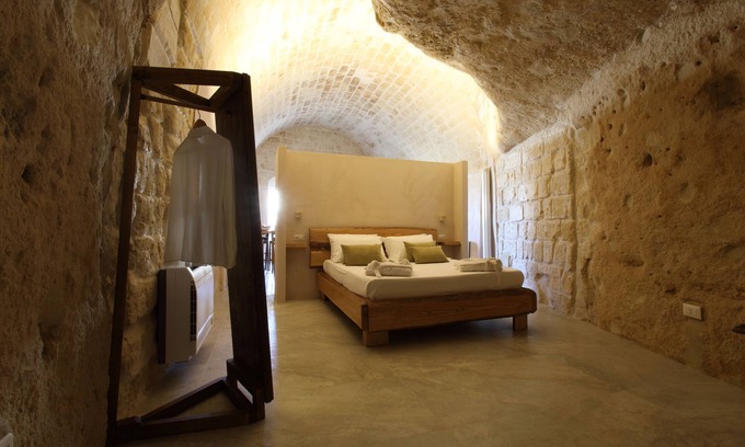 Sasso Barisano Apartment | Suite in cave with terrace and view of Sassi di Matera