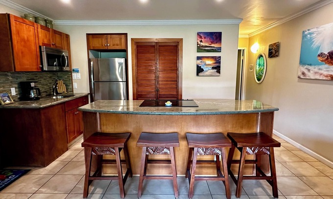 Kihei Condo | Summer DEALS! Partial Ocean View Condo with pool - just steps from the beach.