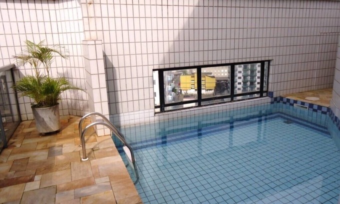 Vila Assuncao Apartment | Terrace with pool and barbecue both of exclusive use, overlooking the sea