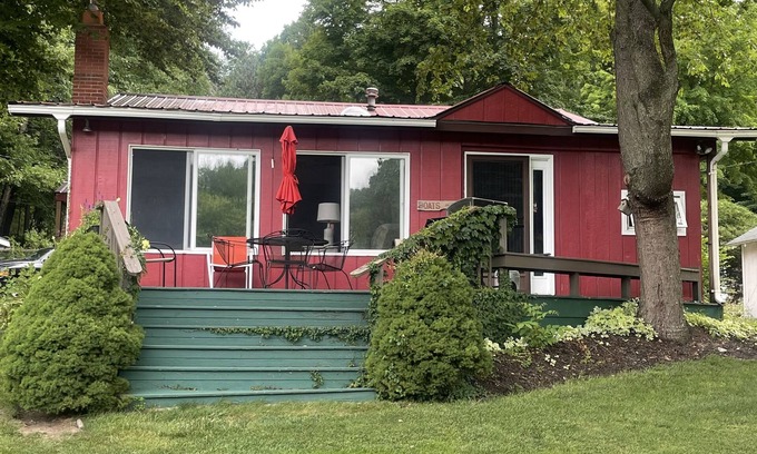 Ludington Cottage | The Bay Cottage has wonderful views of Hamlin lake from its deck 50’ from lake