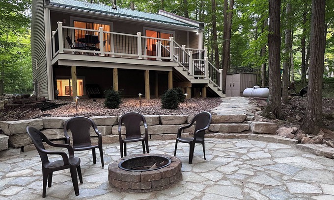 Egg Harbor Cottage | The best patio and firepit at The Cat's Lair in the woods! Level 2 EV charger!