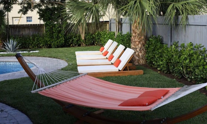 West Palm Beach Villa | The Coral Villa - Heated Pool Spa and Lush Garden